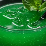 Liquid Marijuana Drink recipe with vibrant green color, fresh mint garnish and ice cubes