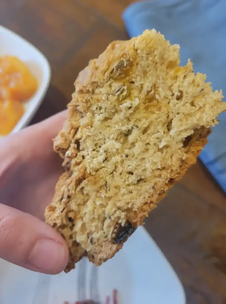 Close-up of sliced sourdough Irish soda bread with raisins