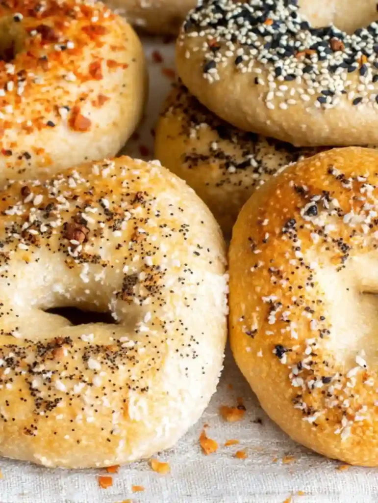 Close-up of sourdough cottage cheese bagels with seed and spice toppings