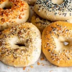 Close-up of sourdough cottage cheese bagels with seed and spice toppings
