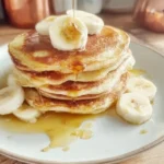 Fluffy 3 ingredient banana pancakes stacked on a plate