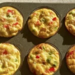 Delicious breakfast egg muffins in a muffin tray, ready to serve.