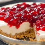 Delicious no-bake cheesecake served on a plate with fresh fruit garnish.