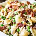 Delicious creamy pasta salad served in a bowl with fresh vegetables