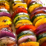 Colorful grilled veggie skewers with bell peppers, zucchini, and mushrooms