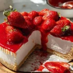 Delicious strawberry cheesecake topped with fresh strawberries